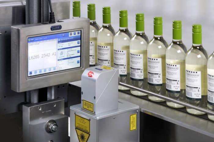 High-speed wine bottling machine with digital control panel at Factronics USA.