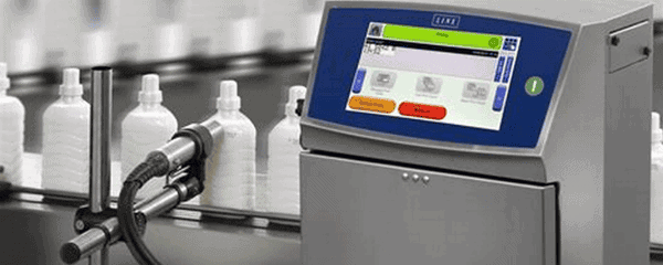 High-tech industrial bottling machine with digital interface for automated liquid filling processes.