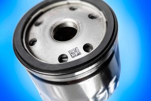 High-quality automotive oil filter with metal top and barcode, essential for engine maintenance.